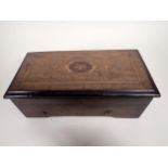 A late 19th Century Musical Box in rosewood and stained case, having satinwood inlay, 14in, A/F -