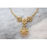 A Victorian Diamond and Seed Pearl Necklace with flowerhead plaque set old-cut diamond within