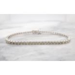 A Diamond Tennis Bracelet claw-set approx fifty nine brilliant-cut stones, total diamond weight 3.