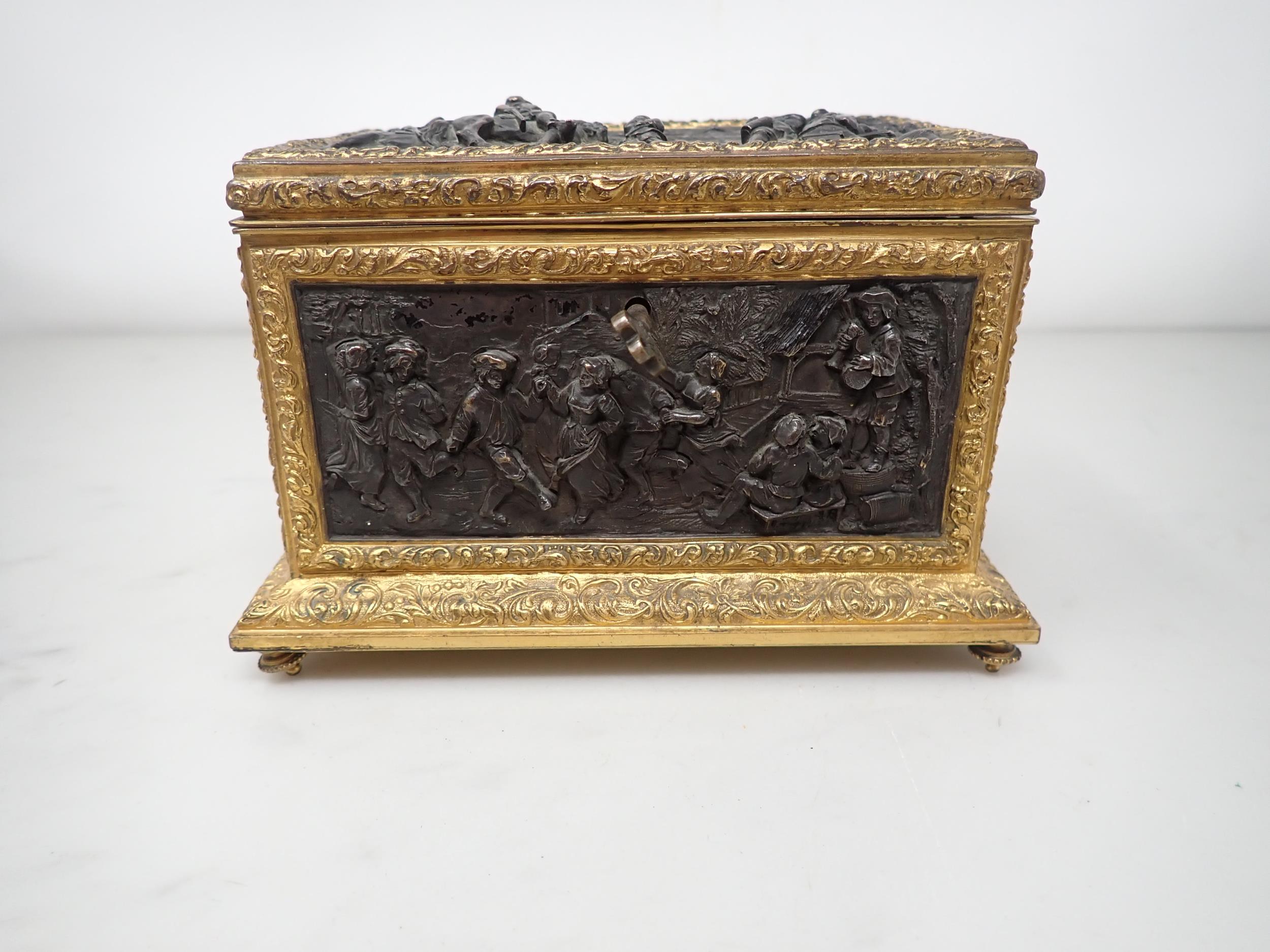 A 19th Century French gilt-metal and bronzed Casket, the inset panels decorated figures merrymaking, - Image 2 of 6