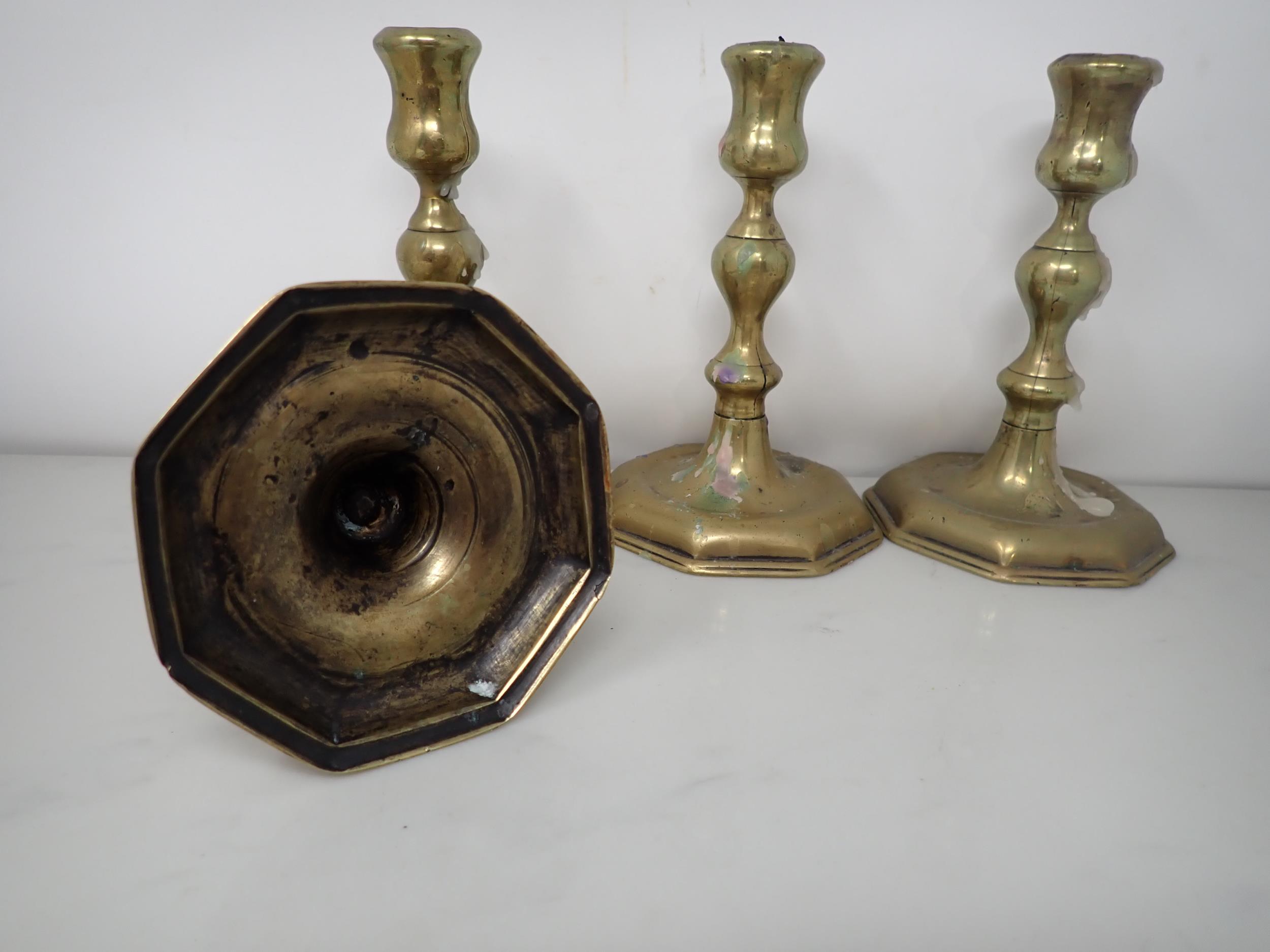 A set of four antique brass Candlesticks with baluster columns on octagonal bases, 6in - Image 2 of 2