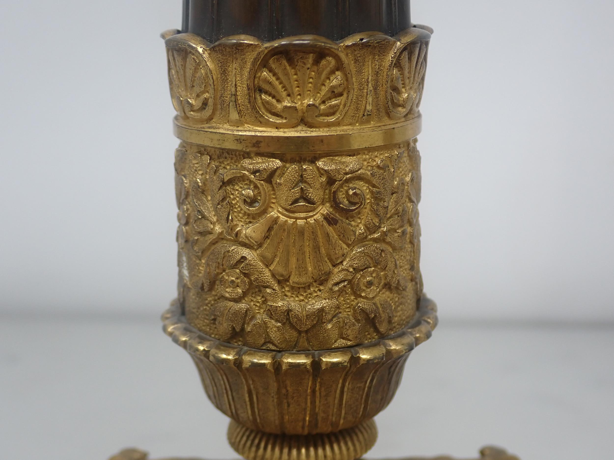 A pair of French Empire Candlesticks in ormolu and bronze, with classical mouldings, plain bronze - Image 4 of 5