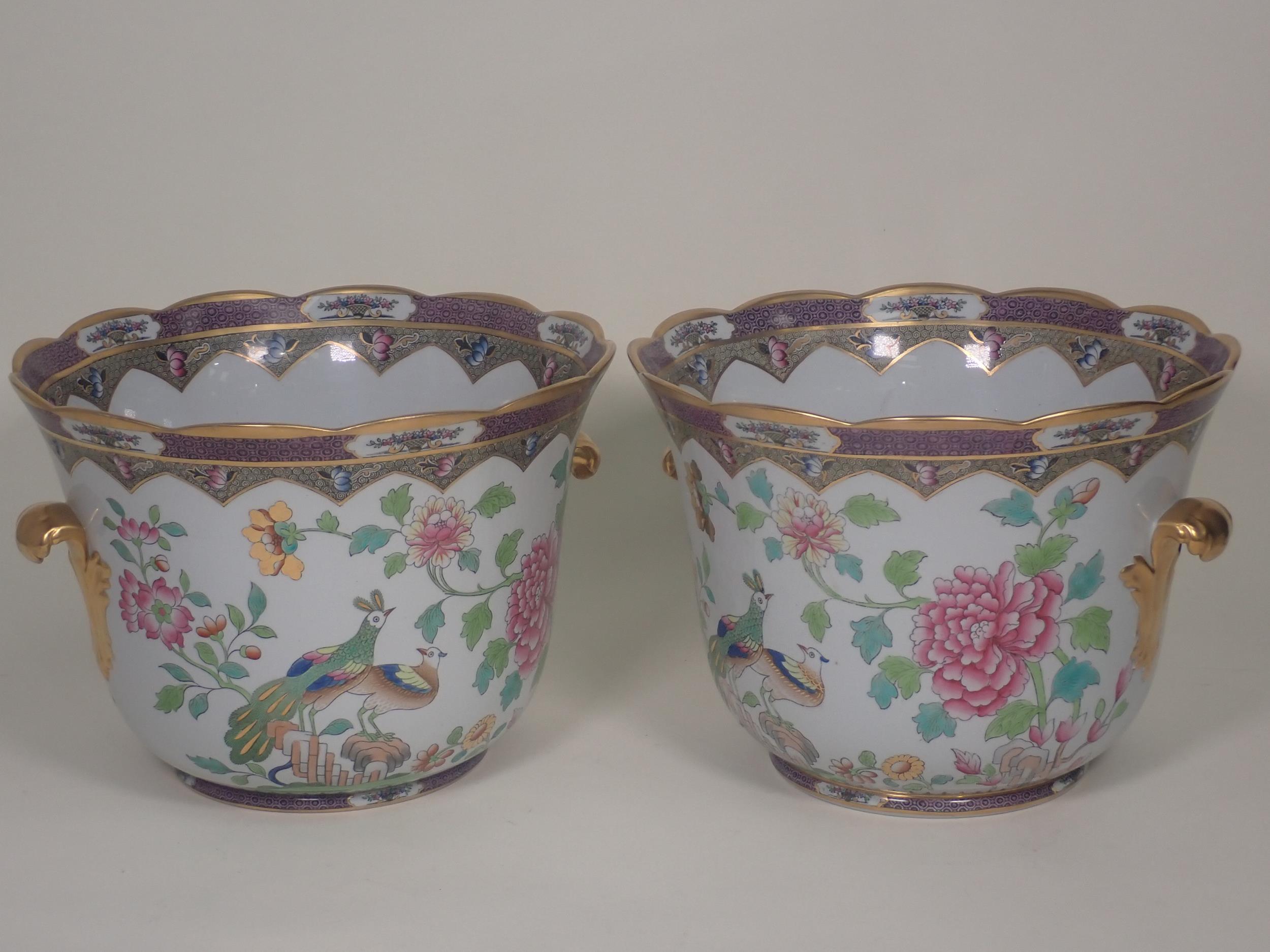 A pair of Spode porcelain Wine Coolers decorated exotic birds amongst flowers with gilded leafage
