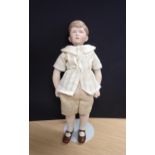 A Prince Charles bisque headed Doll by Martha Thompson USA, 11in