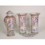 A pair of 19th Century famille rose Vases, cylindrical with flared rims, decorated panels of figures