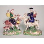 A pair of 19th Century Derby Figures of The Welsh Tailor and his Wife, each figure riding a goat,