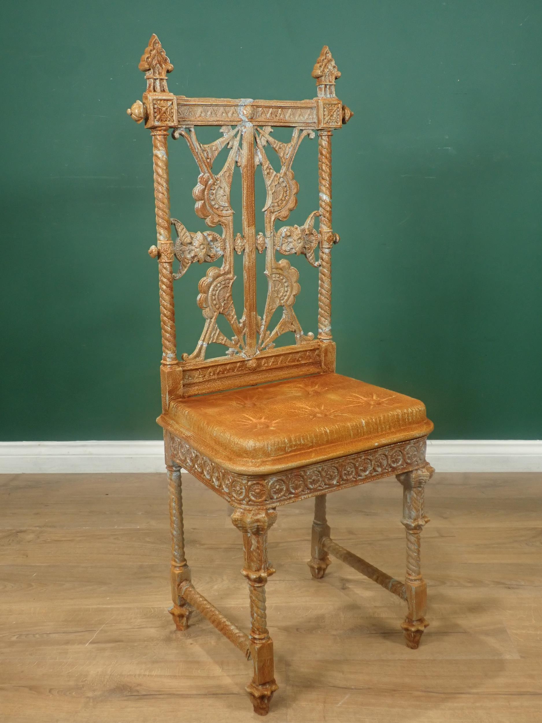 A Coalbrookdale cast iron Chair designed by Christopher Dresser, with pierced back, cast simulated