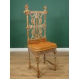 A Coalbrookdale cast iron Chair designed by Christopher Dresser, with pierced back, cast simulated