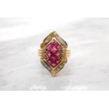 A Ruby and Diamond Cocktail Ring invisibly-set a cluster of ten step-cut rubies within lozenge