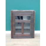 A 17th Century and later oak and glazed Wall Cupboard with channel moulded frame 2ft 11in H x 2ft