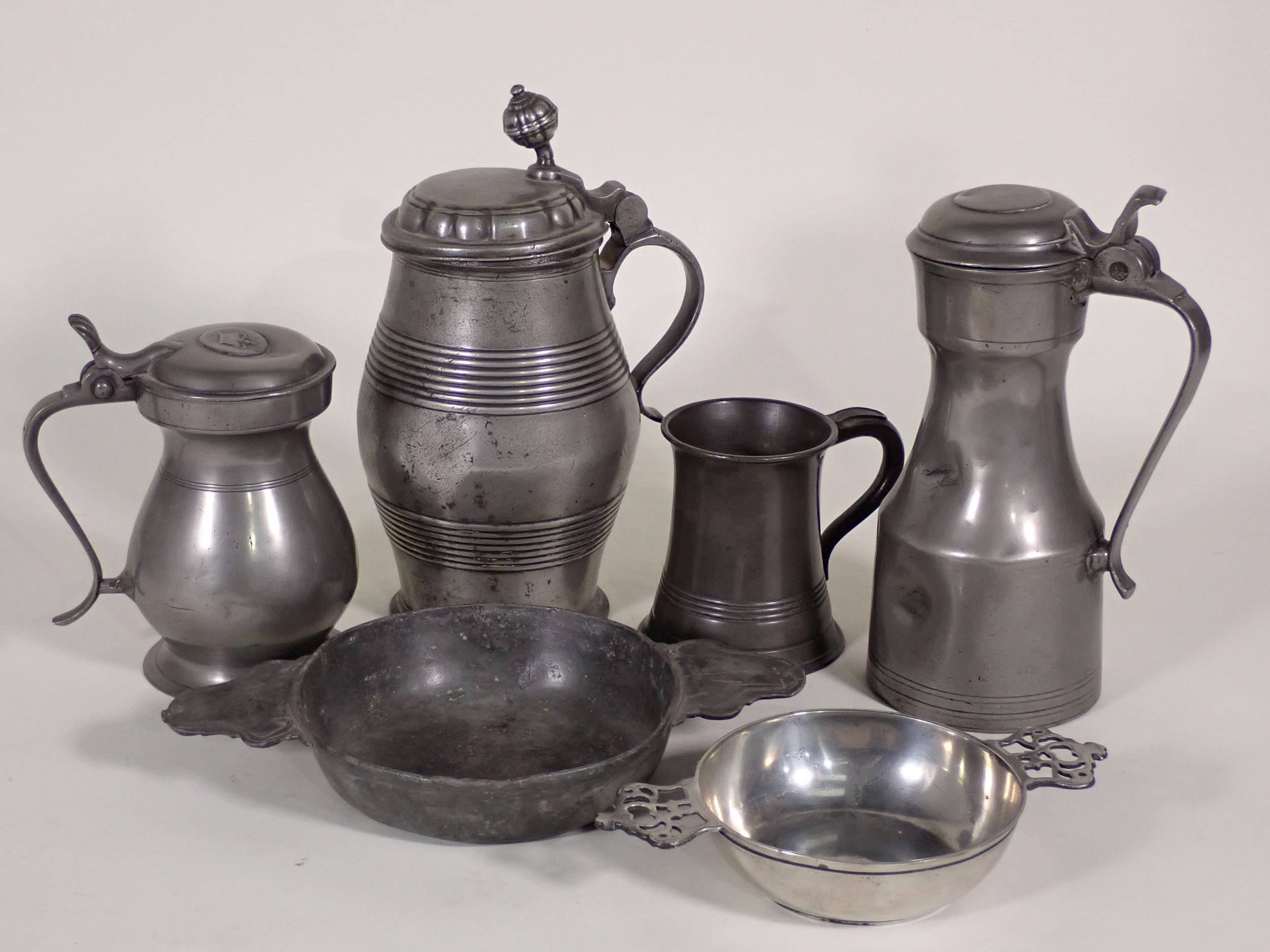 An antique Continental pewter lidded Tankard 9in H, another pewter lidded Tankard with knopped