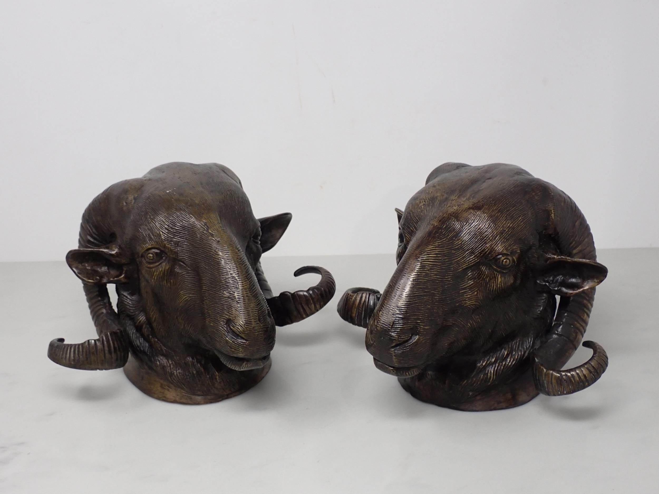 A pair of cast bronze Ram's Masks 7in L x 6in H