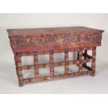 A Chinese Scribe's Table with red lacquered and painted detail having two frieze drawers with