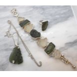 A suite of contemporary silver Jewellery set Moldavite including; Bracelet having seven irregular