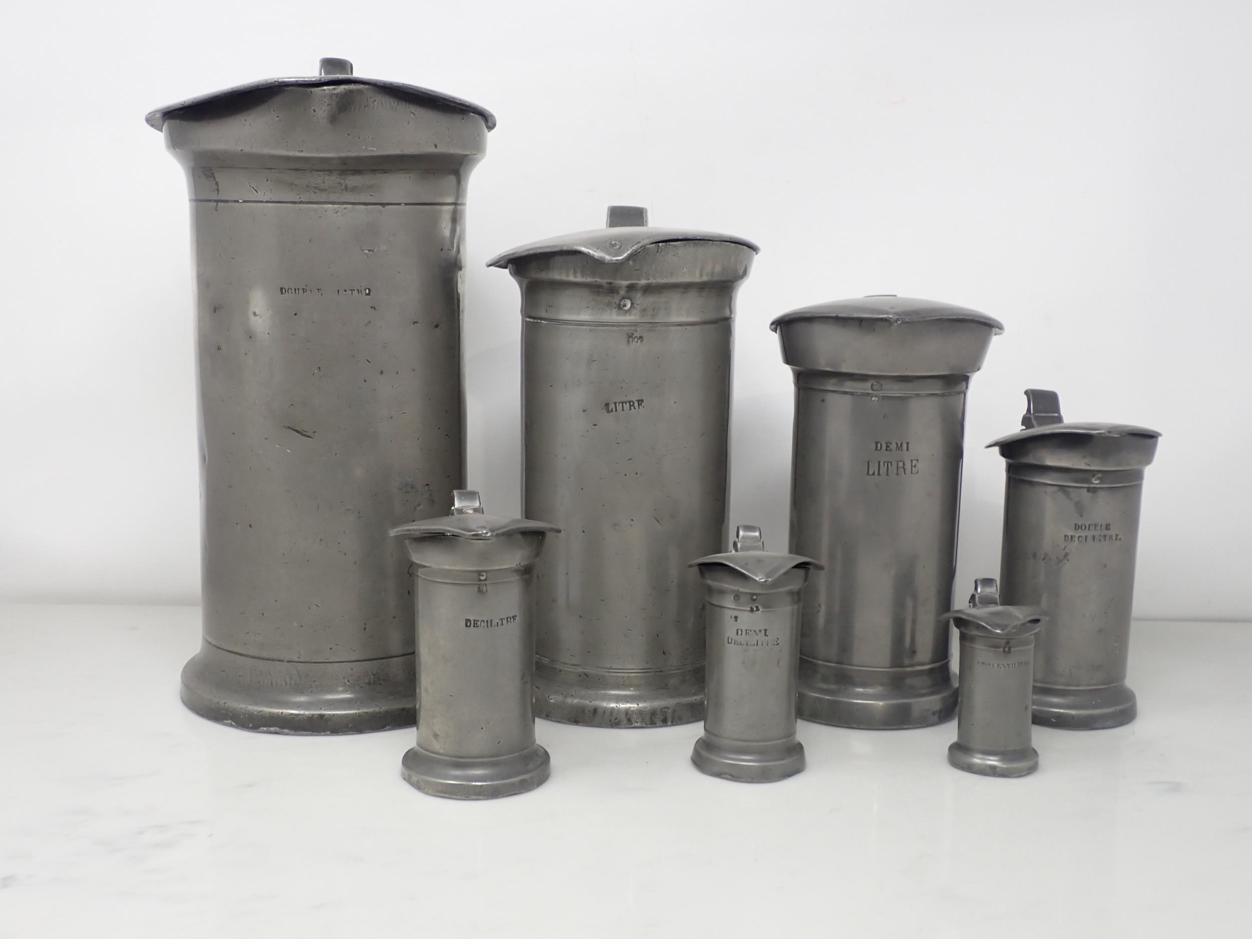 A set of seven French antique pewter graduated Measures with hinged lids, Double Litre - Double - Image 2 of 6