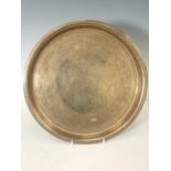 A Persian brass Tray with finely engraved design of exotic birds and flowers, bearing signature,