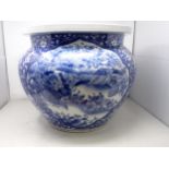 A large Chinese blue and white Fish Bowl with reserves of birds amongst flowering shrubs, prunus