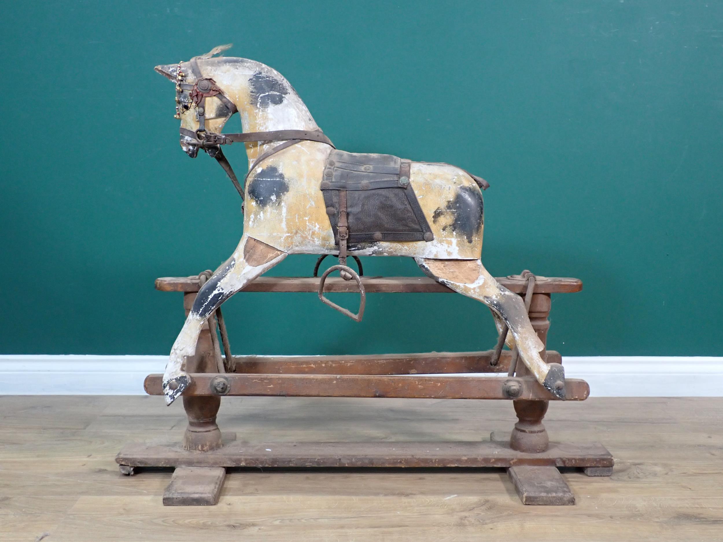 A 19th Century dappled palomino Rocking Horse of small proportions with original saddle and bridle