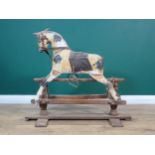 A 19th Century dappled palomino Rocking Horse of small proportions with original saddle and bridle