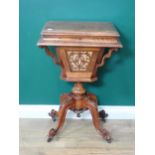 A Victorian walnut Sewing Table with moulded hinged top enclosing compartments, some with fret