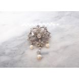 A Diamond and Pearl Brooch the openwork plaque claw-set rose-cut diamond within four channel-set