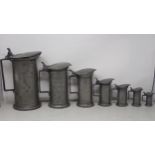 A set of seven French antique pewter graduated Measures with hinged lids, Double Litre - Double