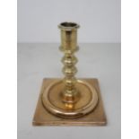 A Georgian brass Candlestick with knopped stem and square base, 5½in H