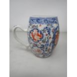 A Chinese barrel shape Mug, painted figures in bright enamels within shaped reserve, floral