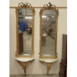 A pair of 18th Century gilt Pier Mirrors with console base, having pierced and scrolled surmounts,