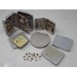 Five Wheatley and unnamed alloy Fly Tins including assorted trout Flies, an alloy circular Rig Tin