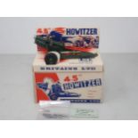 A boxed Britains 4.5'' Howitzer, ex-shop stock, mounted on card base with ammunition in sealed