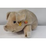 A large Steiff plush pig 18 inches long