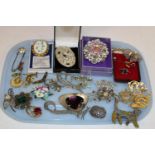 A selection of assorted costume brooches