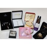 A selection of boxed costume jewellery