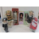 A box of assorted collectable dolls