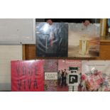 A job lot of framed perfume related posters 60cm x 55cm