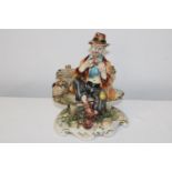 A vintage Capodimonte figurine 26cm tall