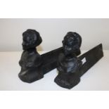 A pair of French cast iron fire dogs