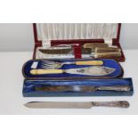 Three boxed sets of assorted carving sets