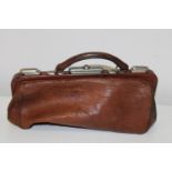 A small leather antique Gladstone bag