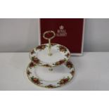 A boxed Royal Albert OCR cake stand