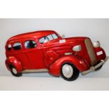 A piece of metal wall art in the form of a vintage car. 70cm x 34cm