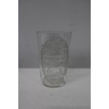 A antique advertising glass 10cm tall