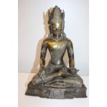 A 19th century Nepalese bronze seated Buddha figure. 34cm x 26cm. Weighs 3.3kgs. (some damage)