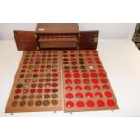 A coin collectors cabinet and contents of coins 29 x 30 x 17cm