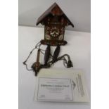A handmade wooden Edelweiss cuckoo clock in GWO