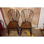 A pair of antique wheel back elm chairs h87cm Collection Only