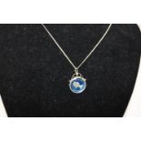 A silver enamelled sixpence & chain