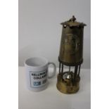 A vintage brass coal miners lamp & pit check & Kellingley Colliery mug