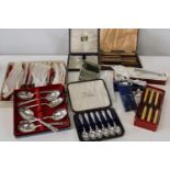 A job lot of assorted boxed cutlery etc